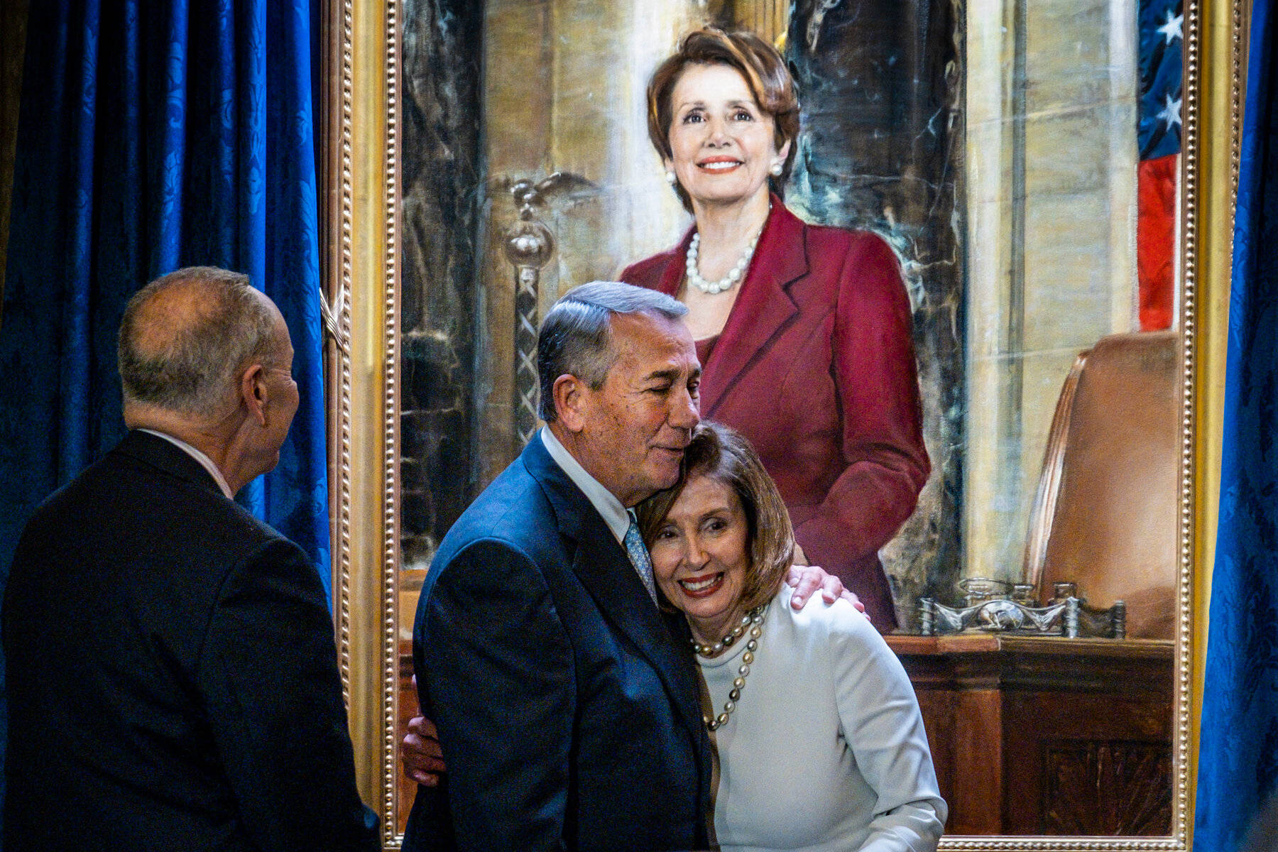 Nancy Pelosi receiving a heartfelt hug - a captivating painting Wallpaper