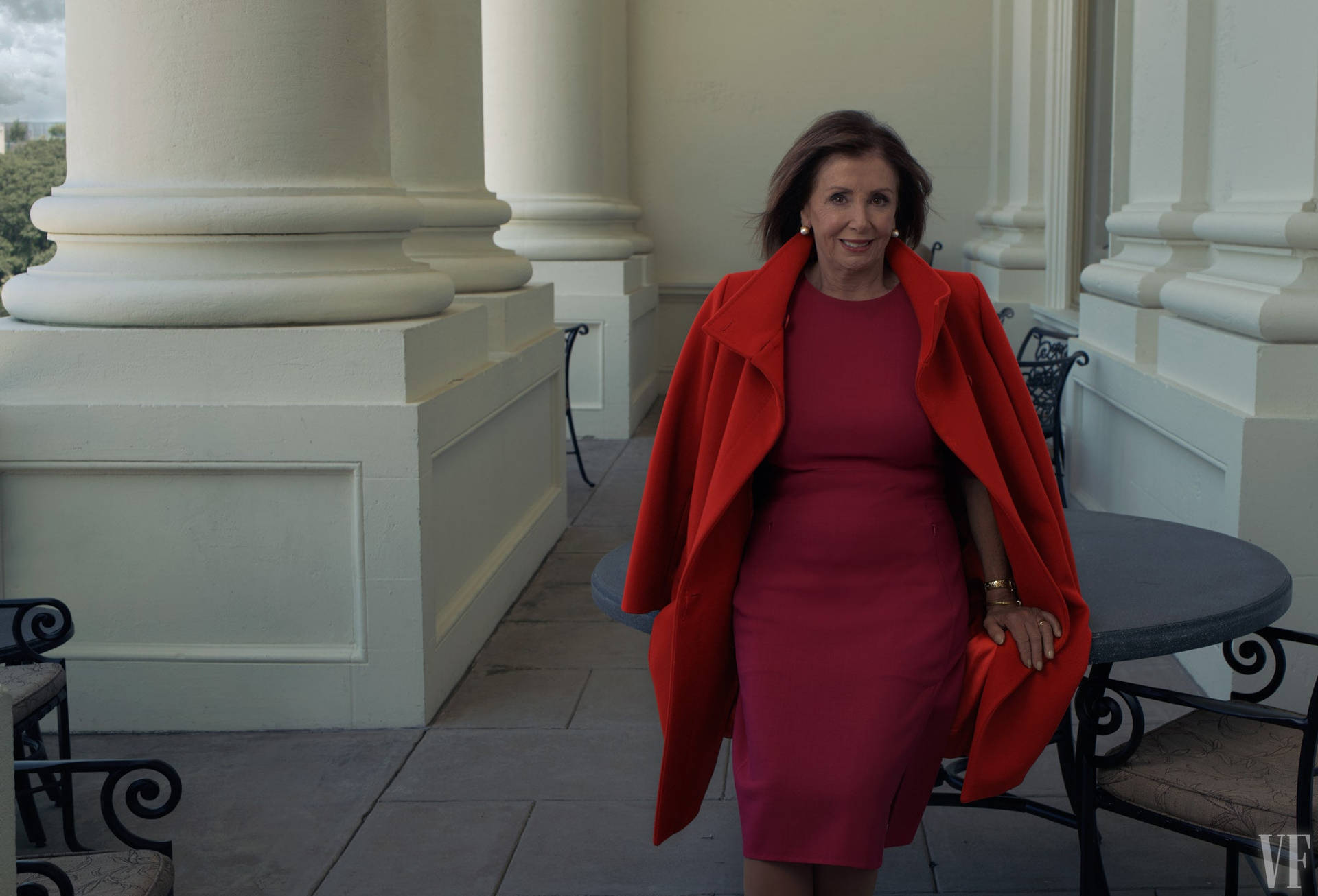 U.S. House Speaker Nancy Pelosi wearing a vibrant red ensemble Wallpaper