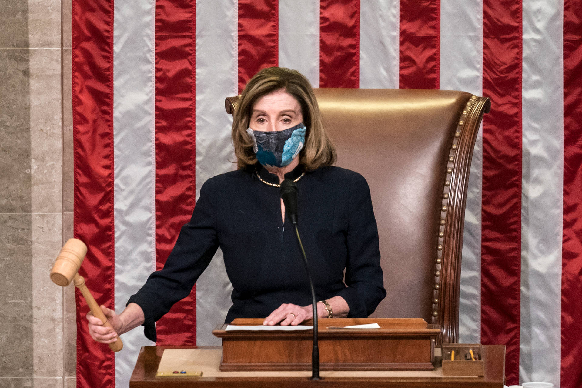Nancy Pelosi Holding a Gavel While Wearing a Mask Wallpaper