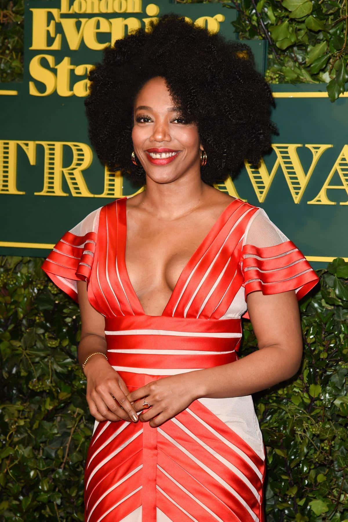 Naomi Ackie Red Striped Dress Event Wallpaper