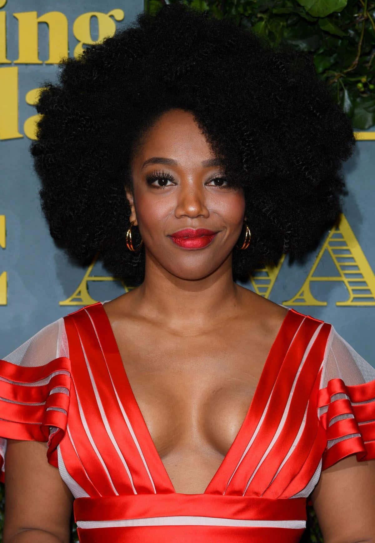 Naomi Ackie Red Striped Dress Event Wallpaper