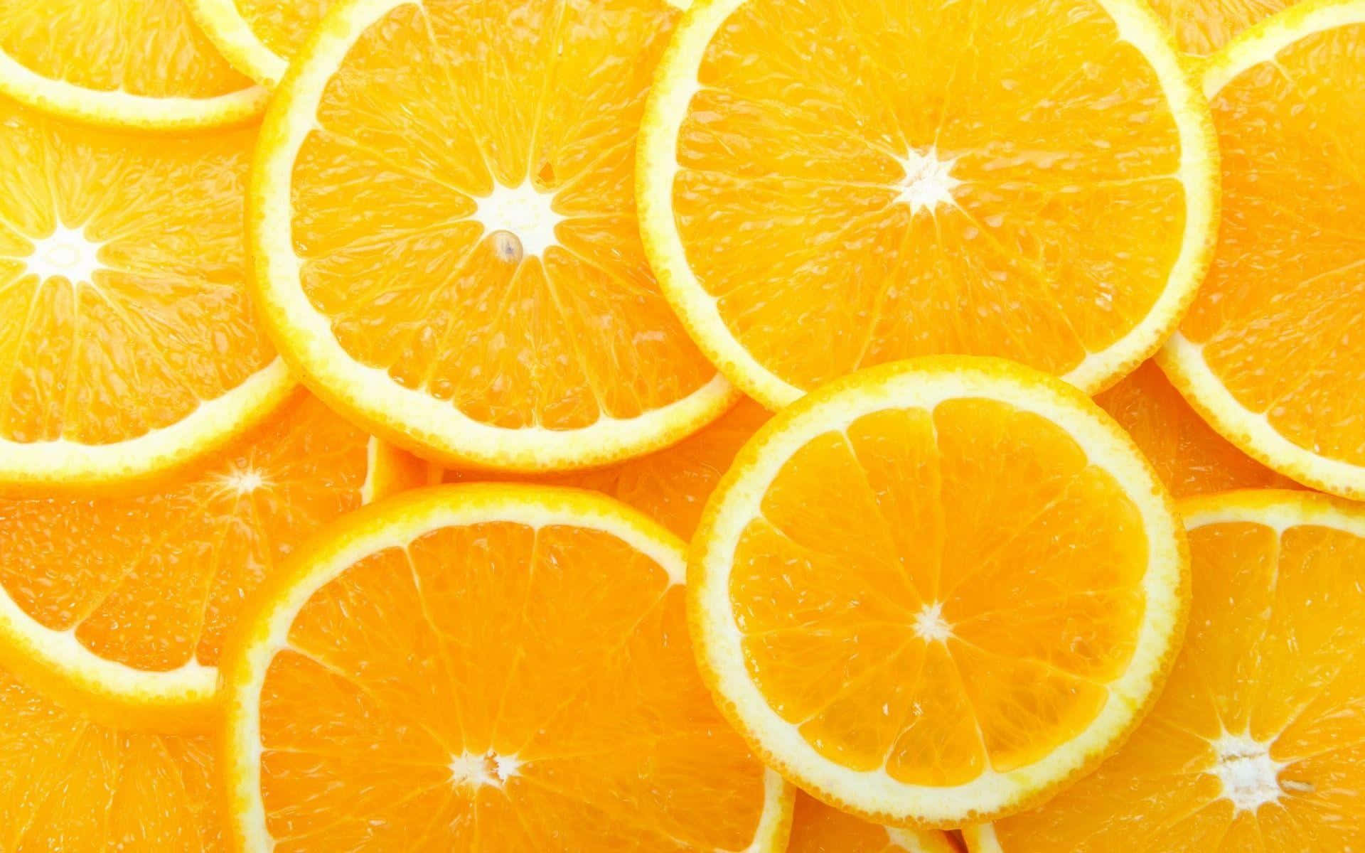 Naranjasfrescas Y Vibrantes En Una Rama.