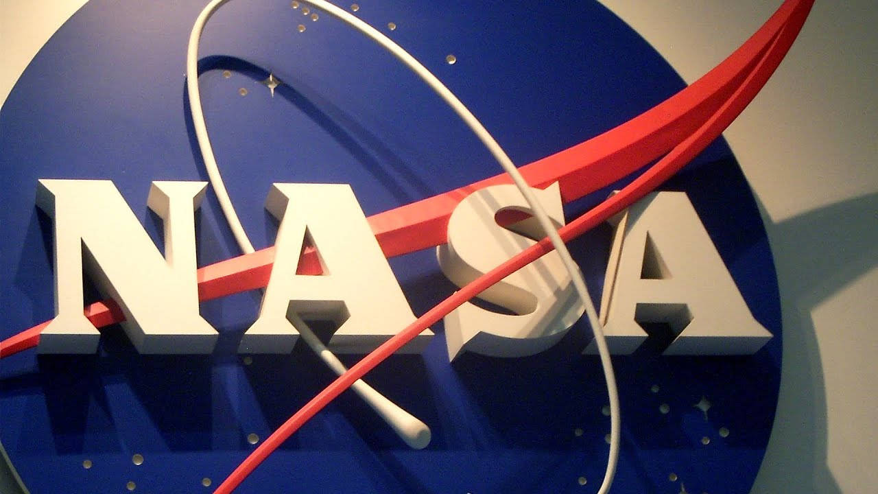 NASA Houston Logo Signage Tapet: Se ud som om du er ombord på det amerikanske rumfartøj med det let genkendelige NASA Houston logo signatur-tapet. Wallpaper