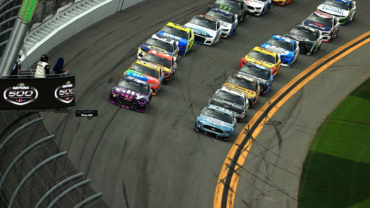 A Group Of Cars On A Track