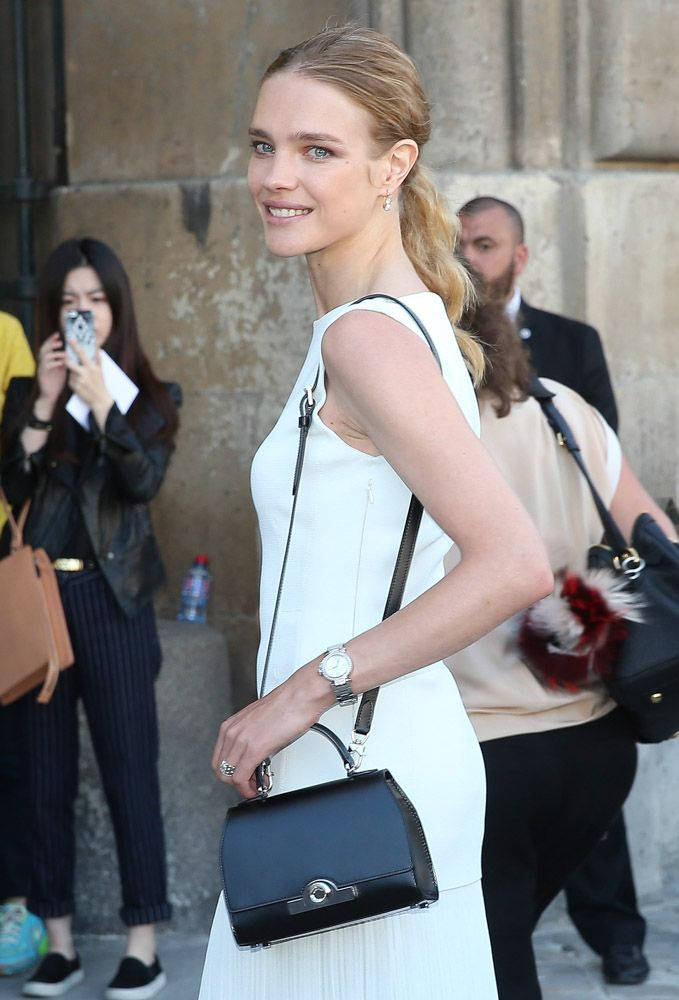 Natalia Vodianova holding a luxurious Moynat bag Wallpaper