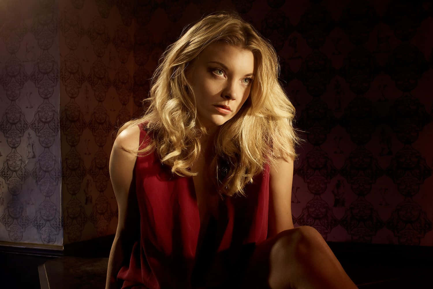 A stunning portrait of Natalie Dormer with a captivating smile Wallpaper