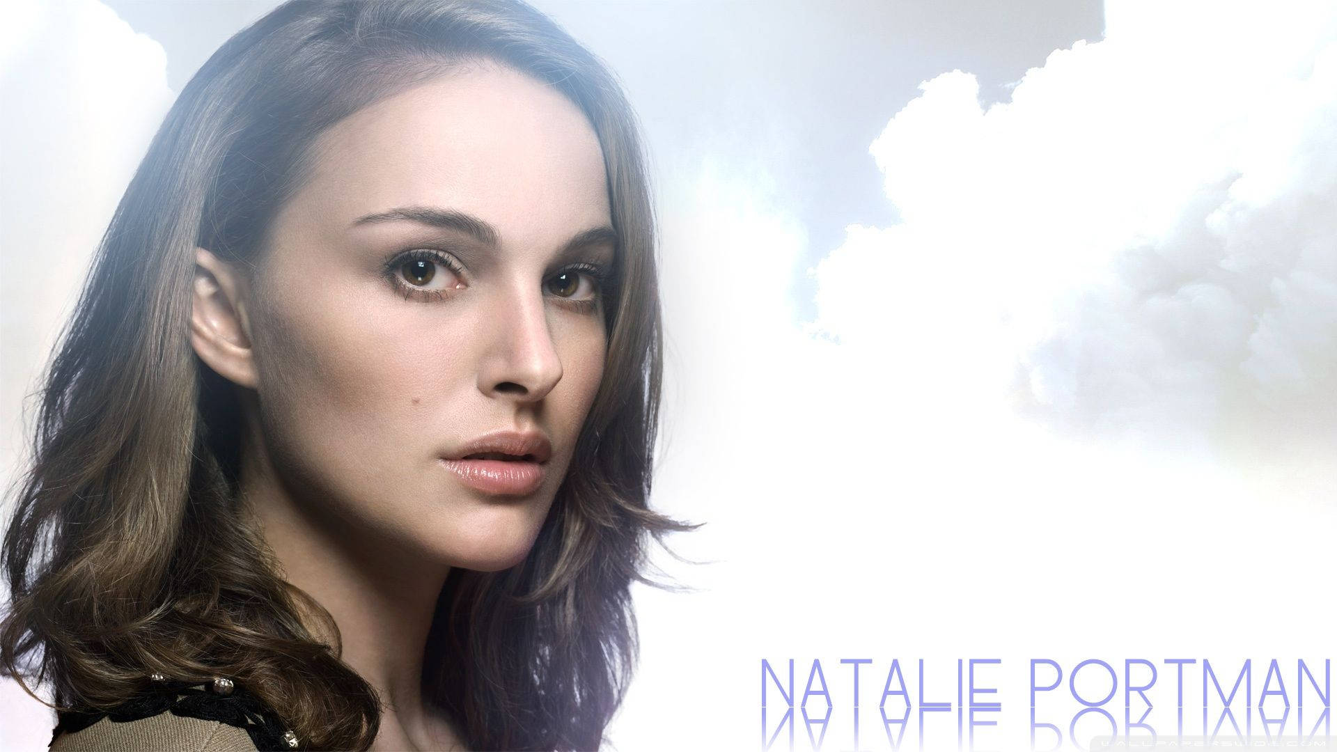 Caption: Natalie Portman Poses Against a Cloudy Background Wallpaper