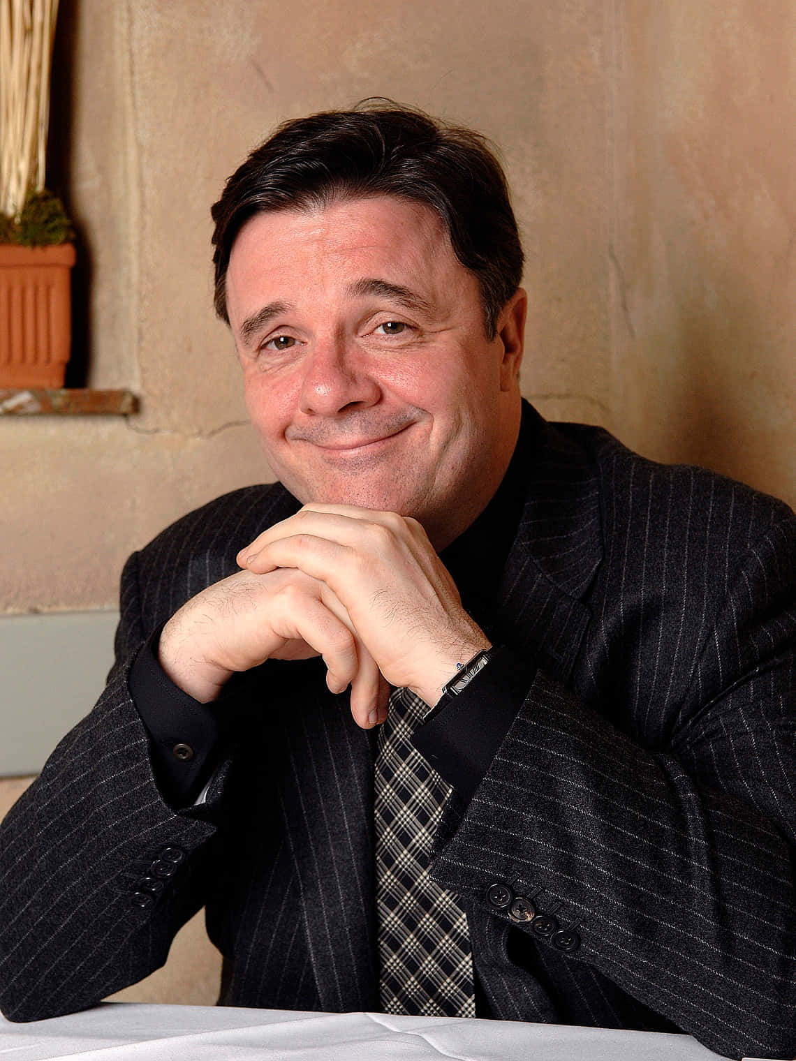 Actor Nathan Lane attending an awards show Wallpaper