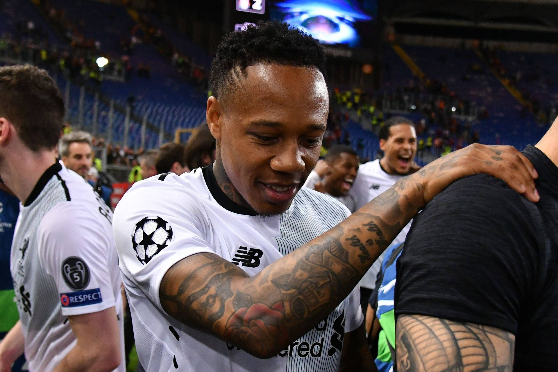 Nathaniel Clyne Holding On To Person Wallpaper