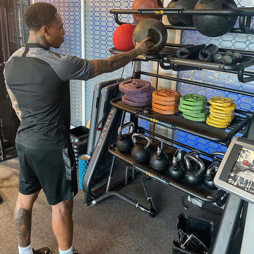 Caption: Professional Footballer Nathaniel Clyne Training at the Gym Wallpaper