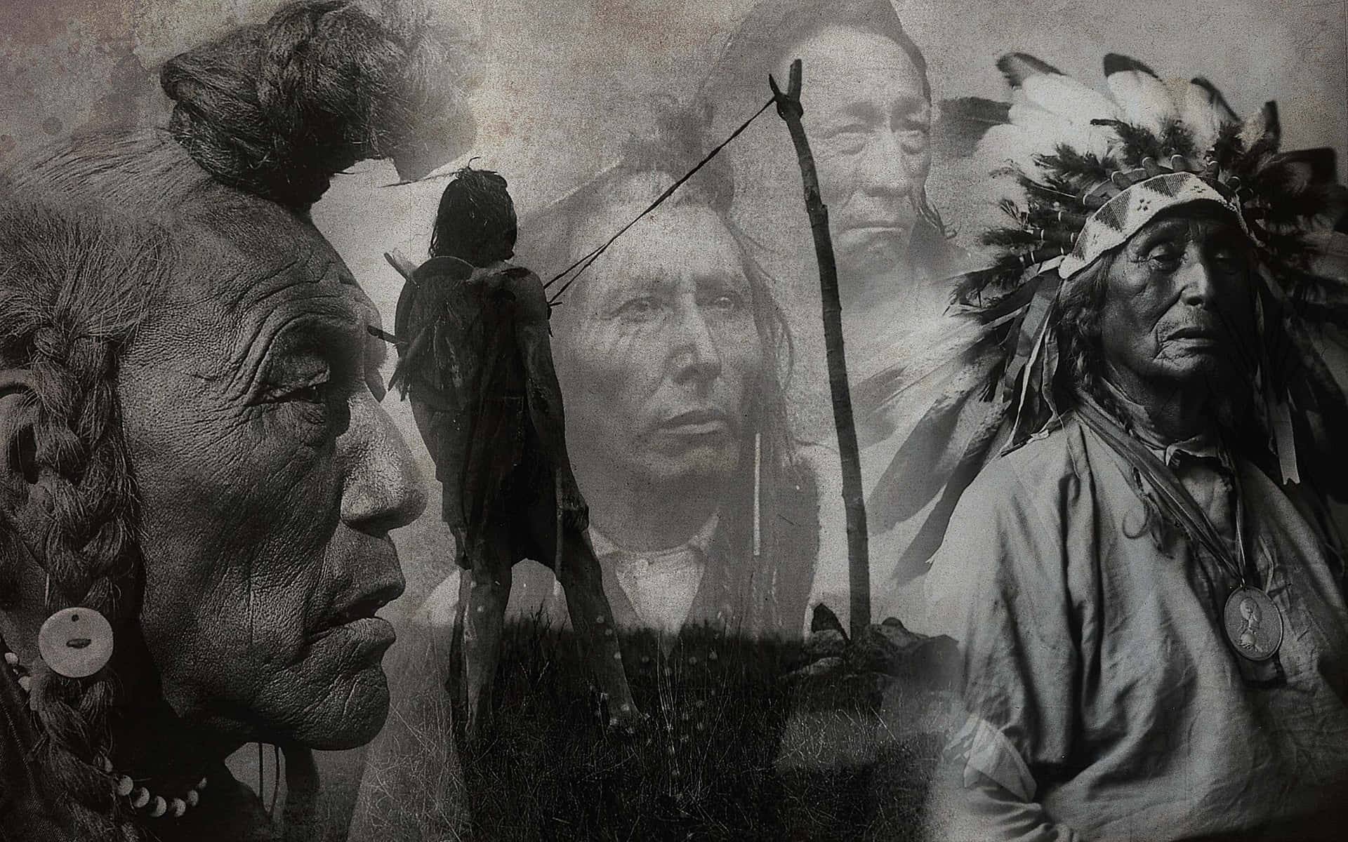 A proud and stoic Native American Indian stands against a lush landscape. Wallpaper
