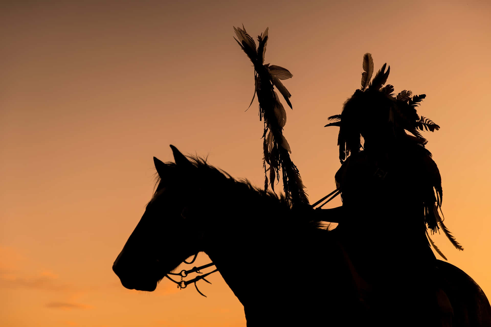 Silhouette Of A Native American Man On Horseback Wallpaper