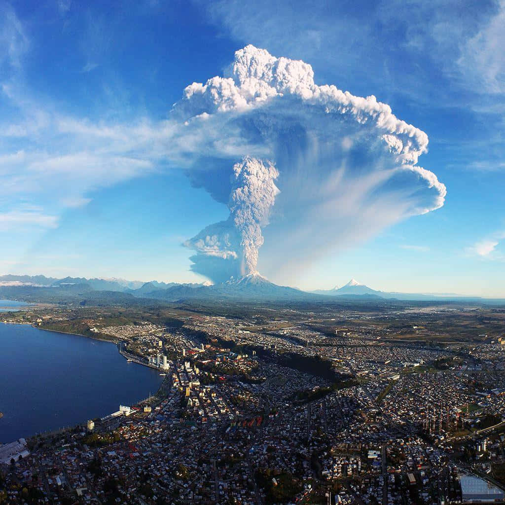 A Volcano Is Seen Rising Above A City