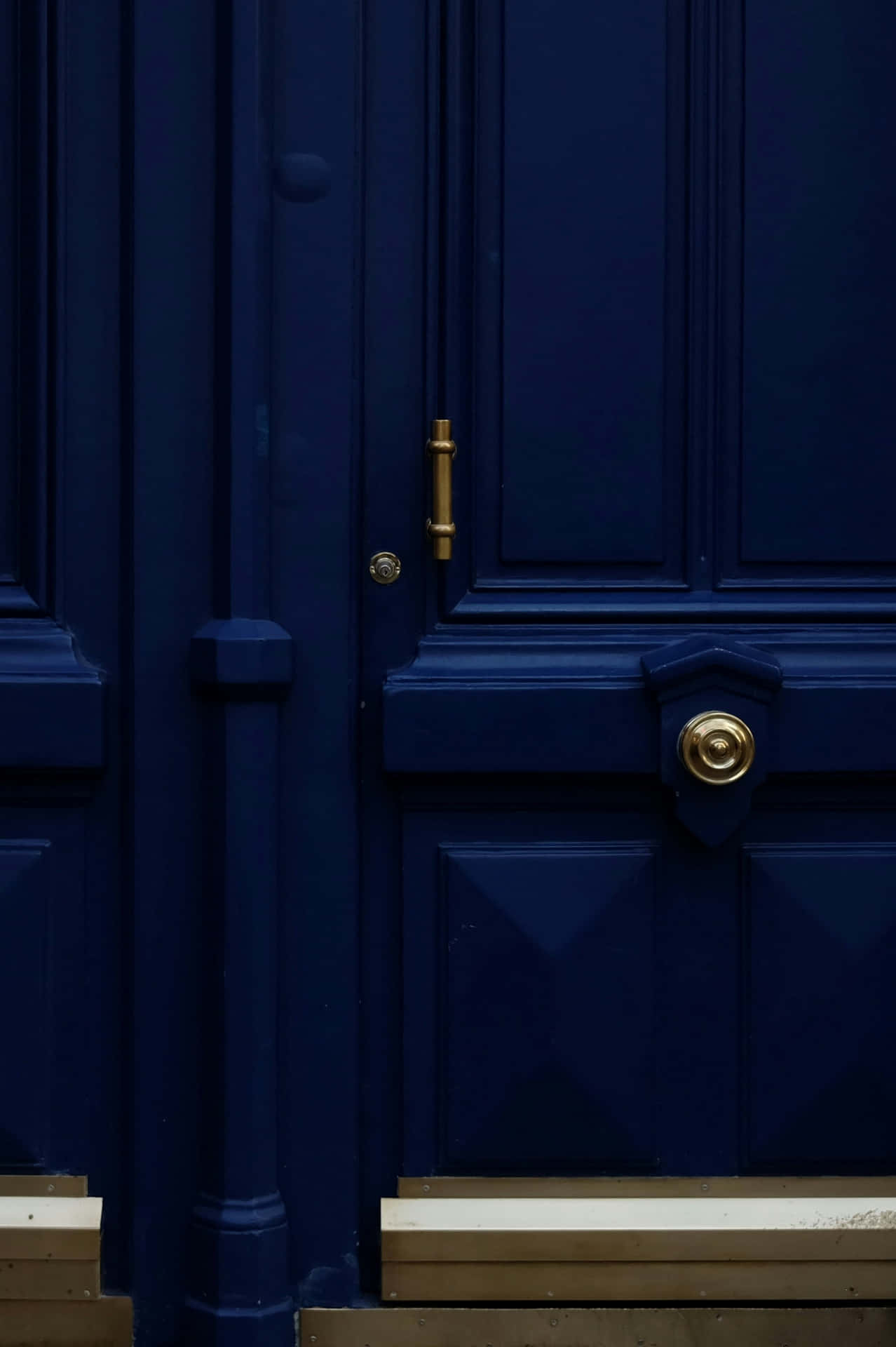 Navy Blue Doorwith Gold Hardware Wallpaper