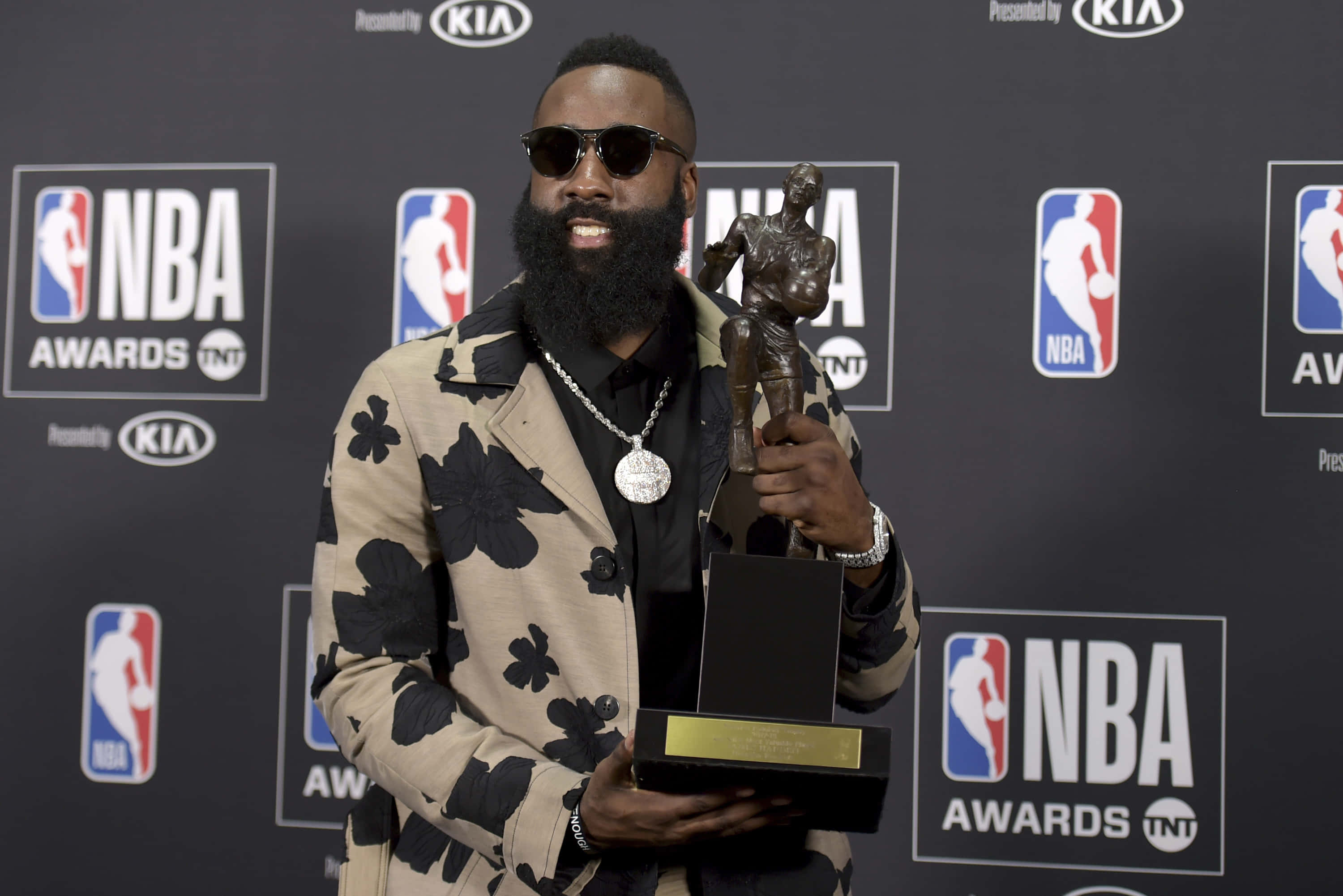 Nba Player Holding Trophy At Nba Awards Wallpaper