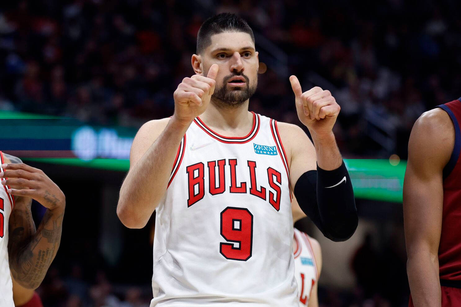 Nba Player Nikola Vucevic Chicago Bulls Thumbs Up Background