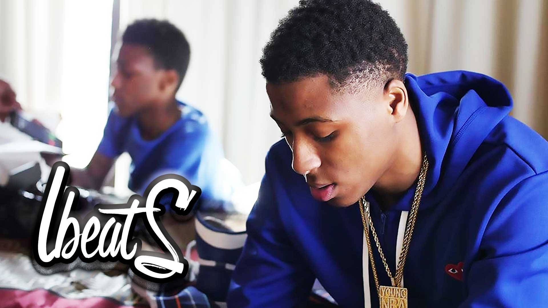 Nba Youngboy In Blue Hoodie Background