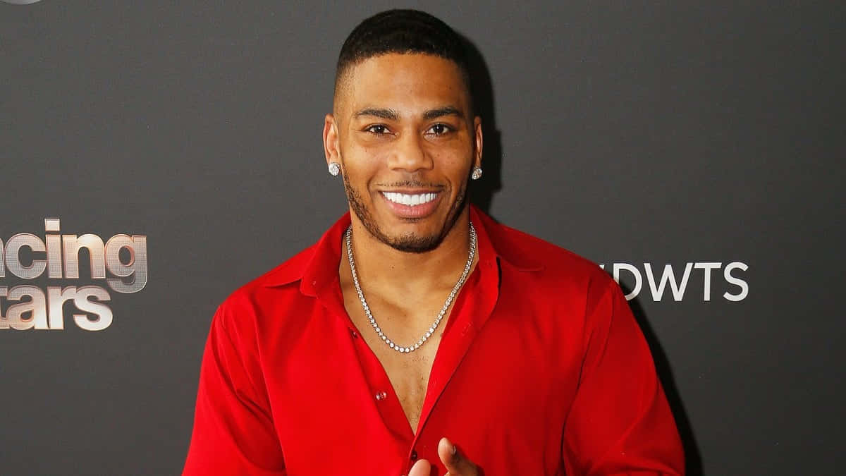 Nelly Smiling In Front Of Dancing With The Stars Poster Wallpaper