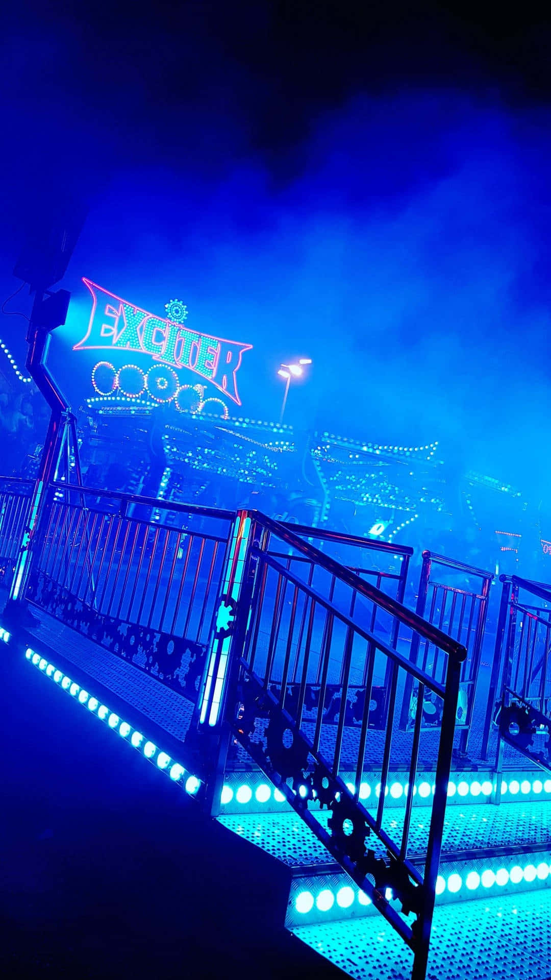 Neon Blue Amusement Park Ride Nighttime Wallpaper