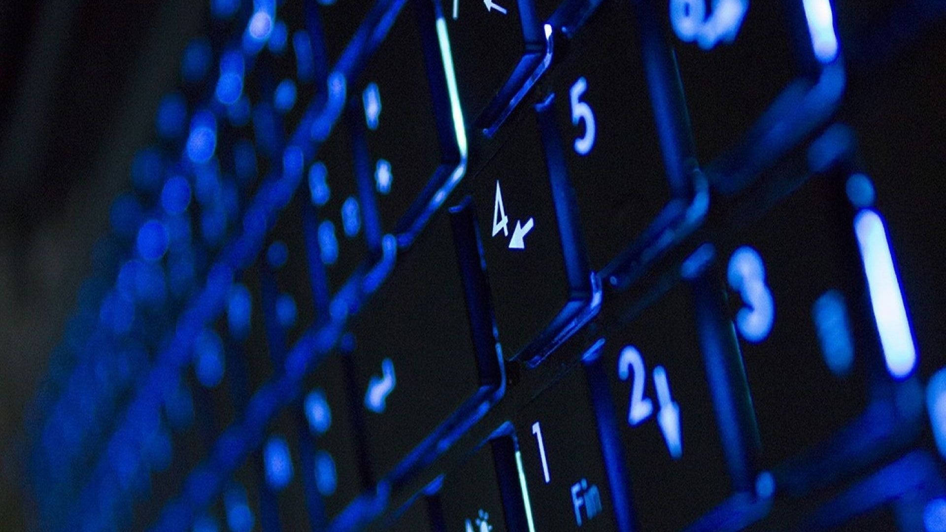 Illuminated Neon Blue Keyboard Wallpaper