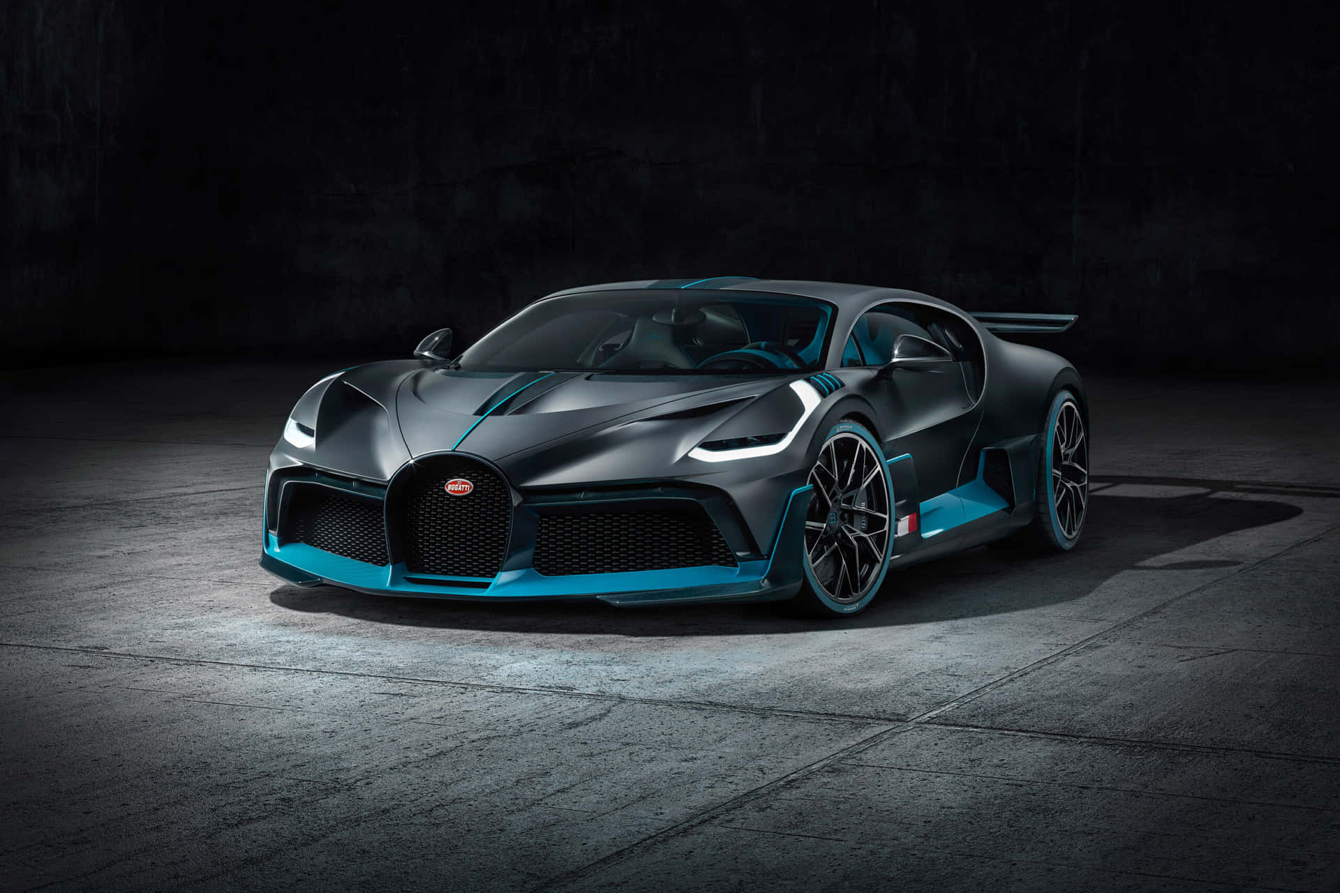 The Bugatti Chiron Is Shown In A Dark Room Wallpaper