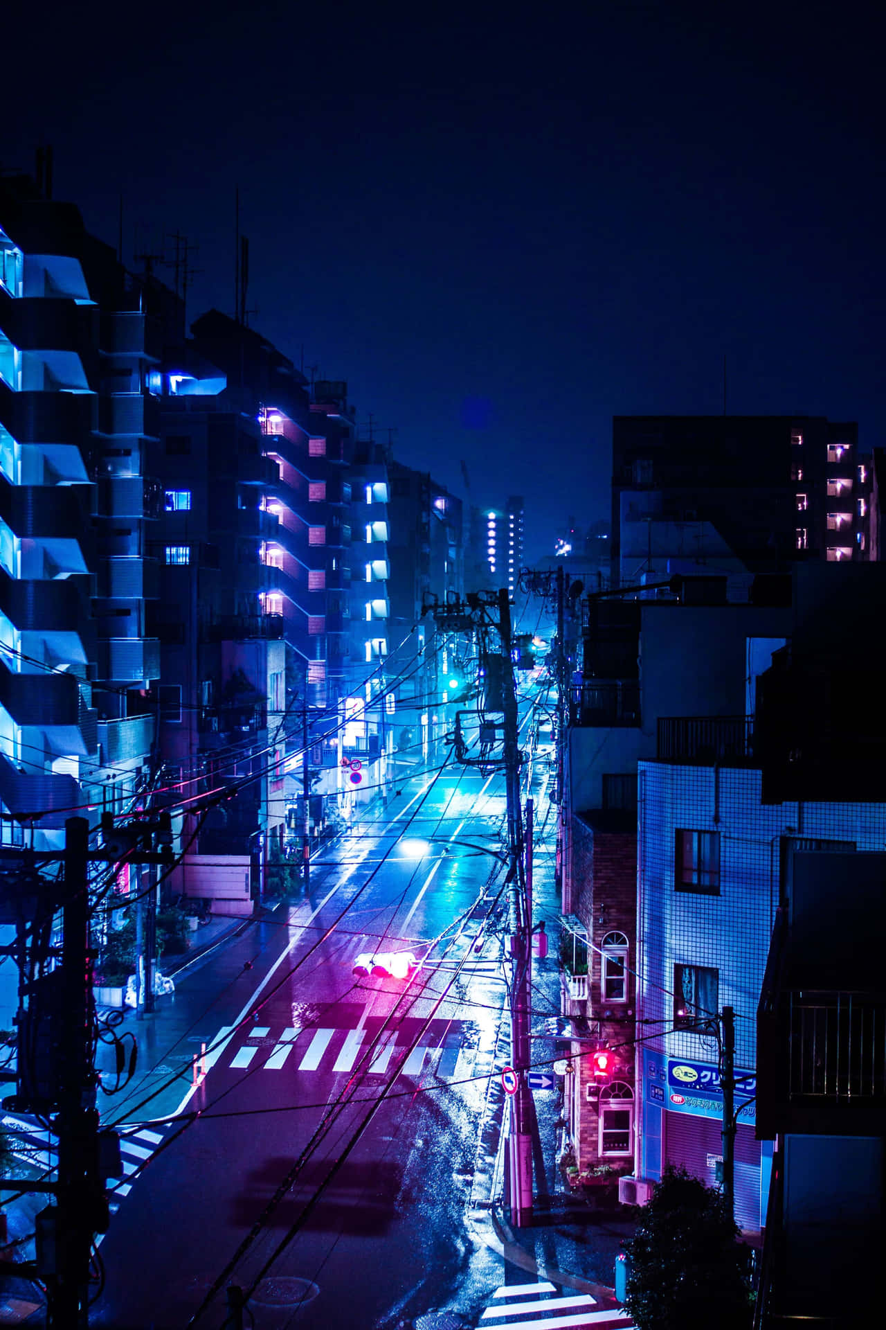 En by gade om natten Wallpaper