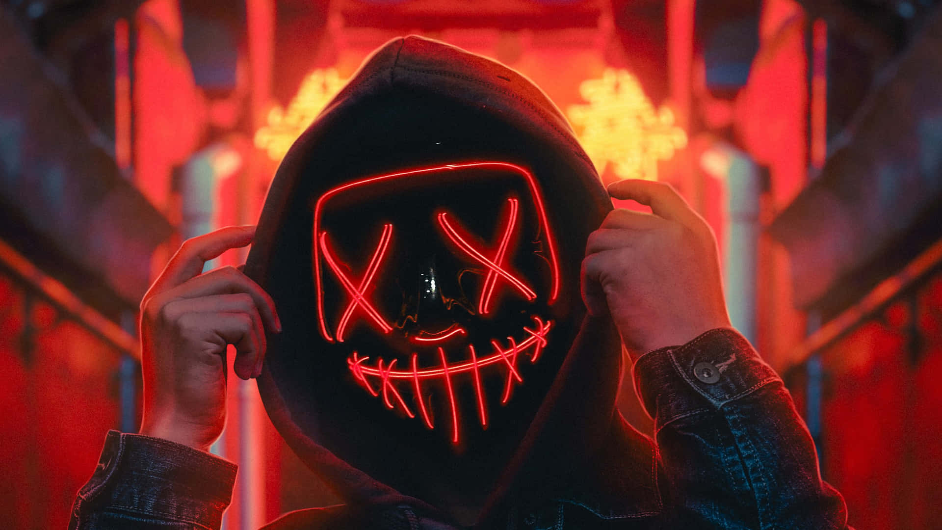 A Person Wearing A Neon Mask With A Hoodie Wallpaper