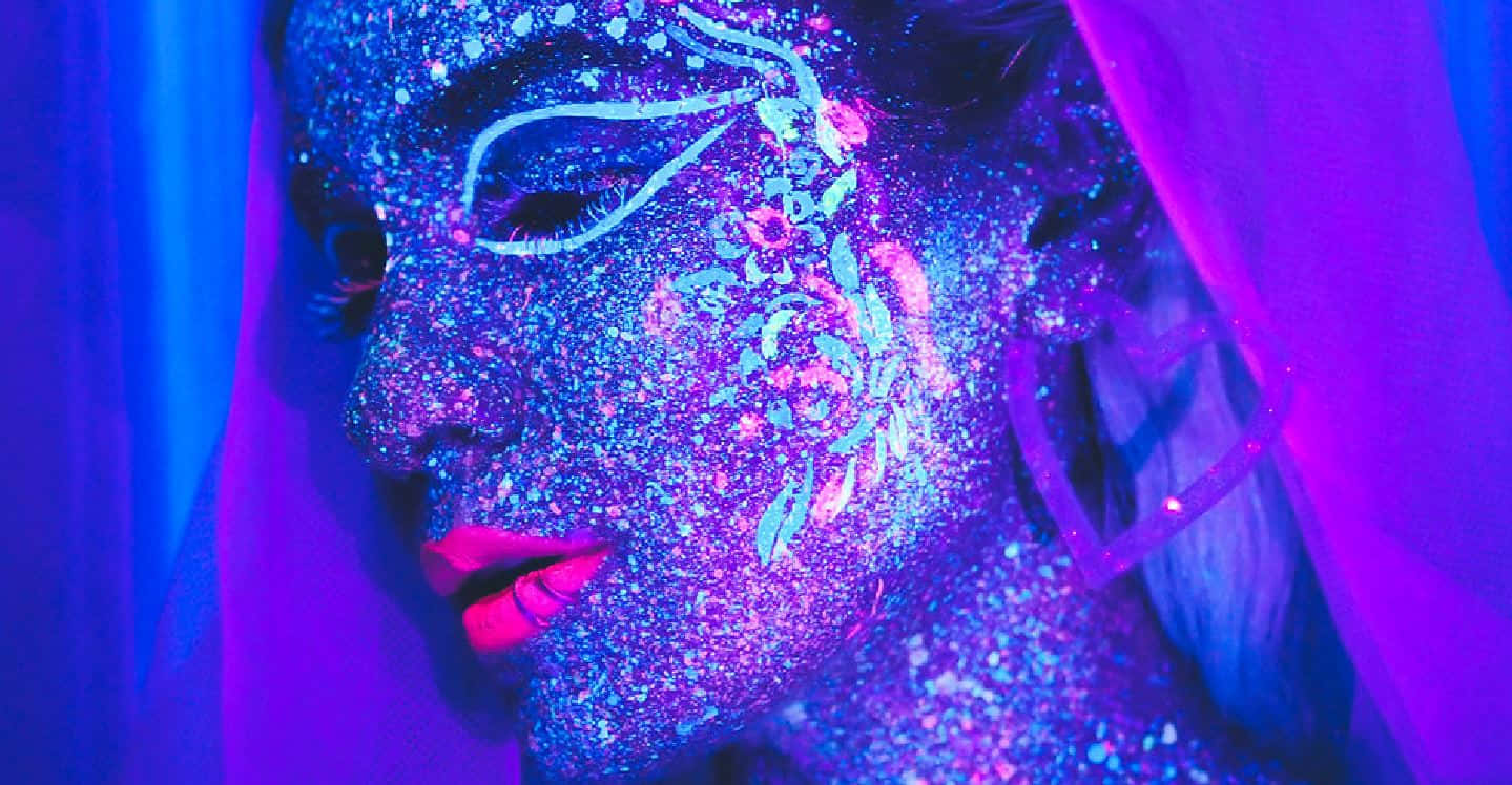 Neon_ Glitter_ Makeup_ Under_ Black_ Light Wallpaper