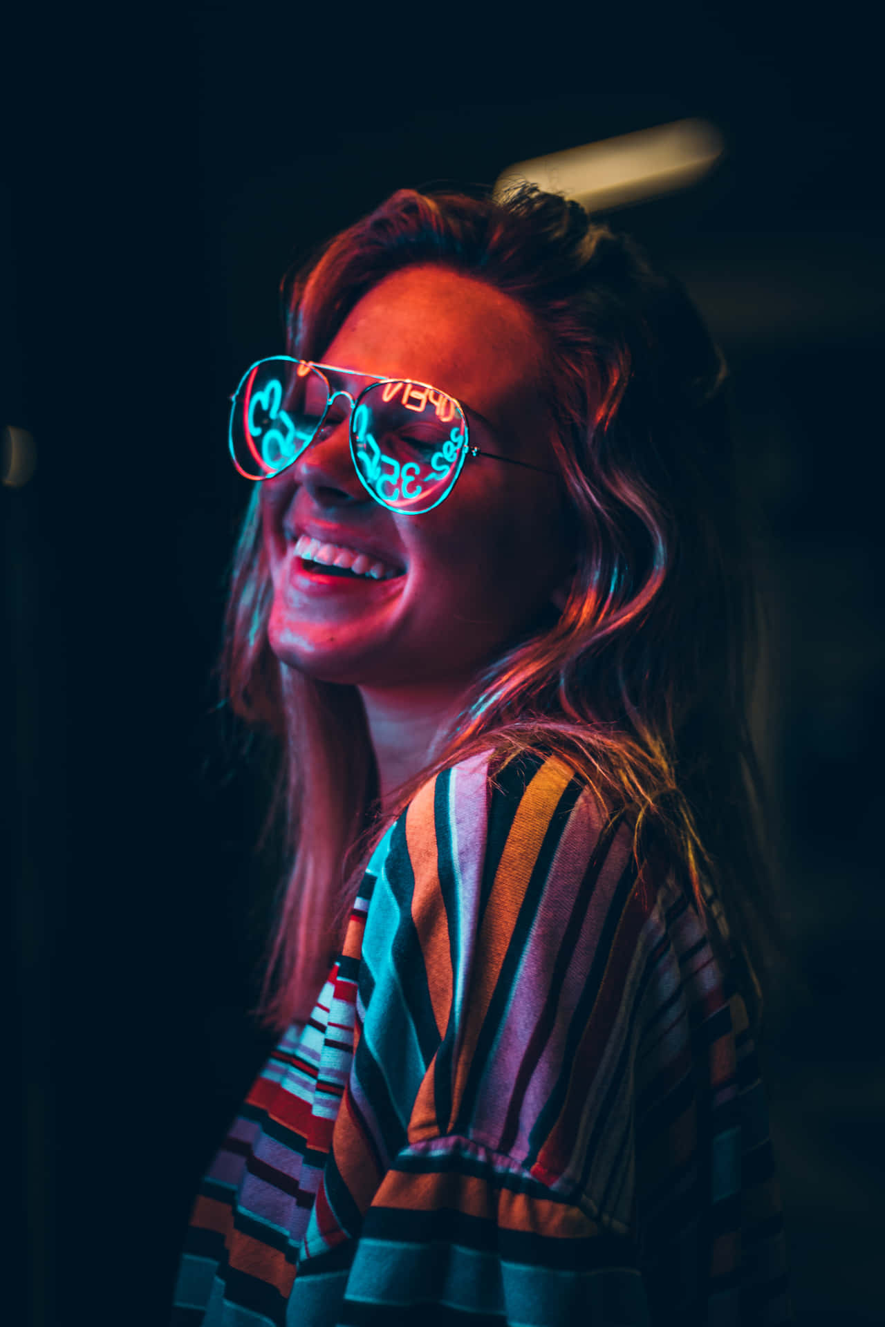 Neon Glow Smiling Woman Wallpaper