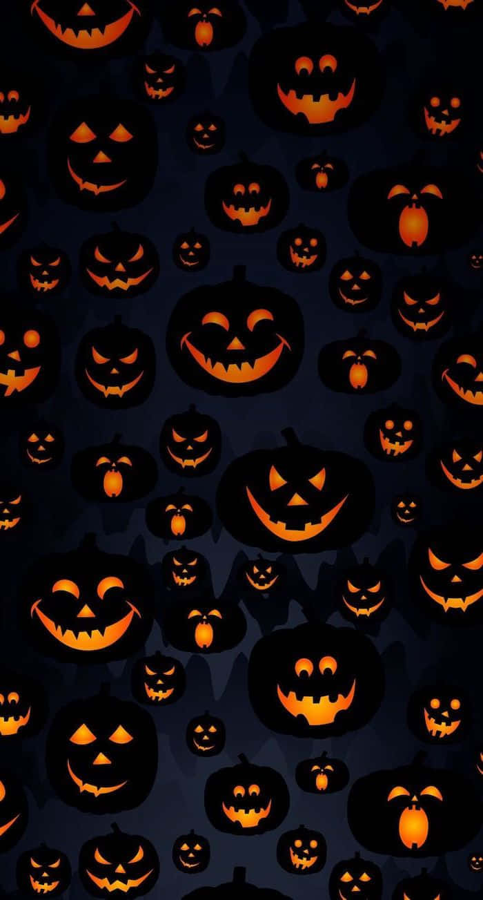 Calabazasde Halloween Sobre Un Fondo Oscuro Fondo de pantalla