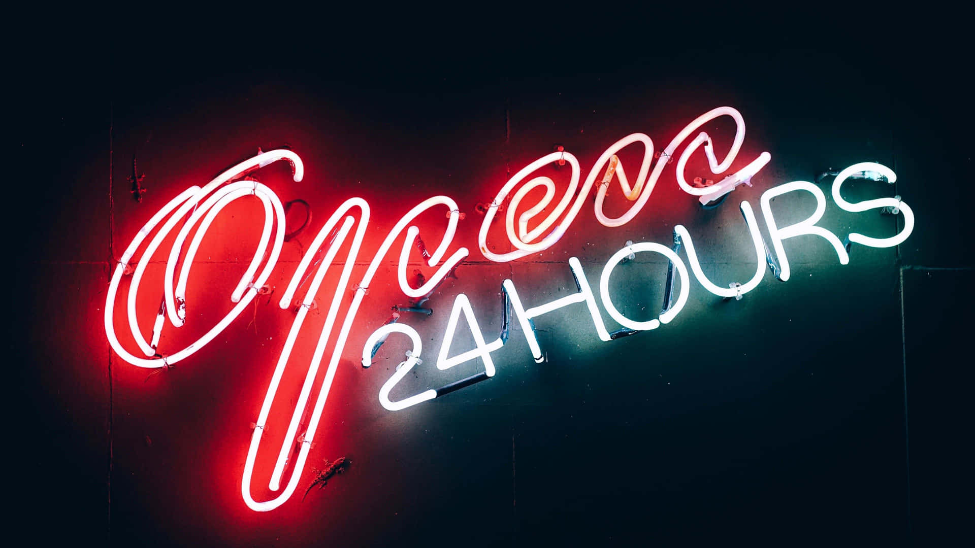 A Neon Sign That Says Open 24 Hours