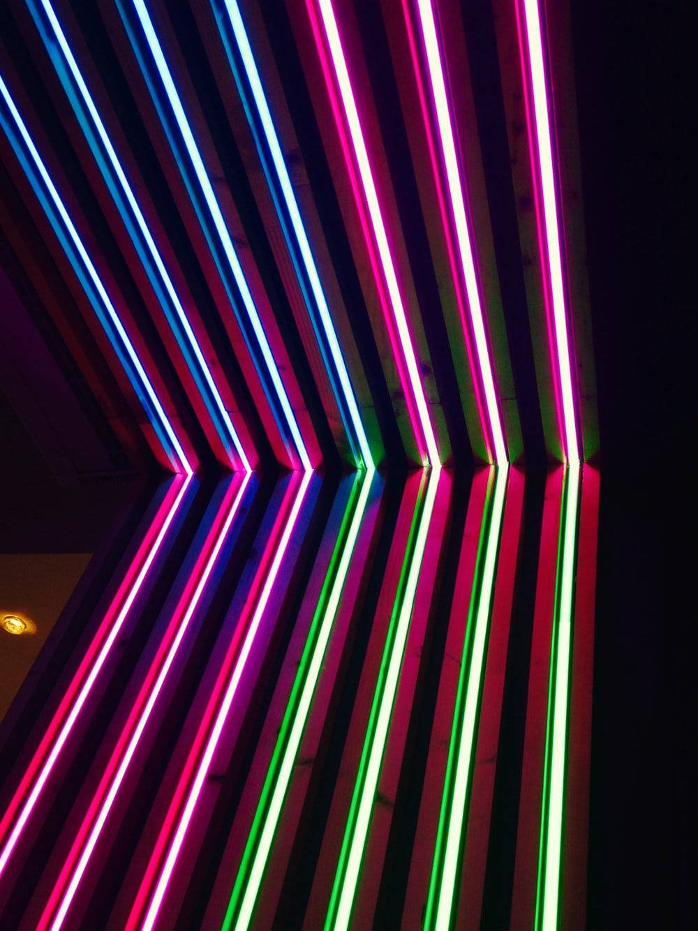 Vibrant Corner Illuminated by Neon Light Wallpaper