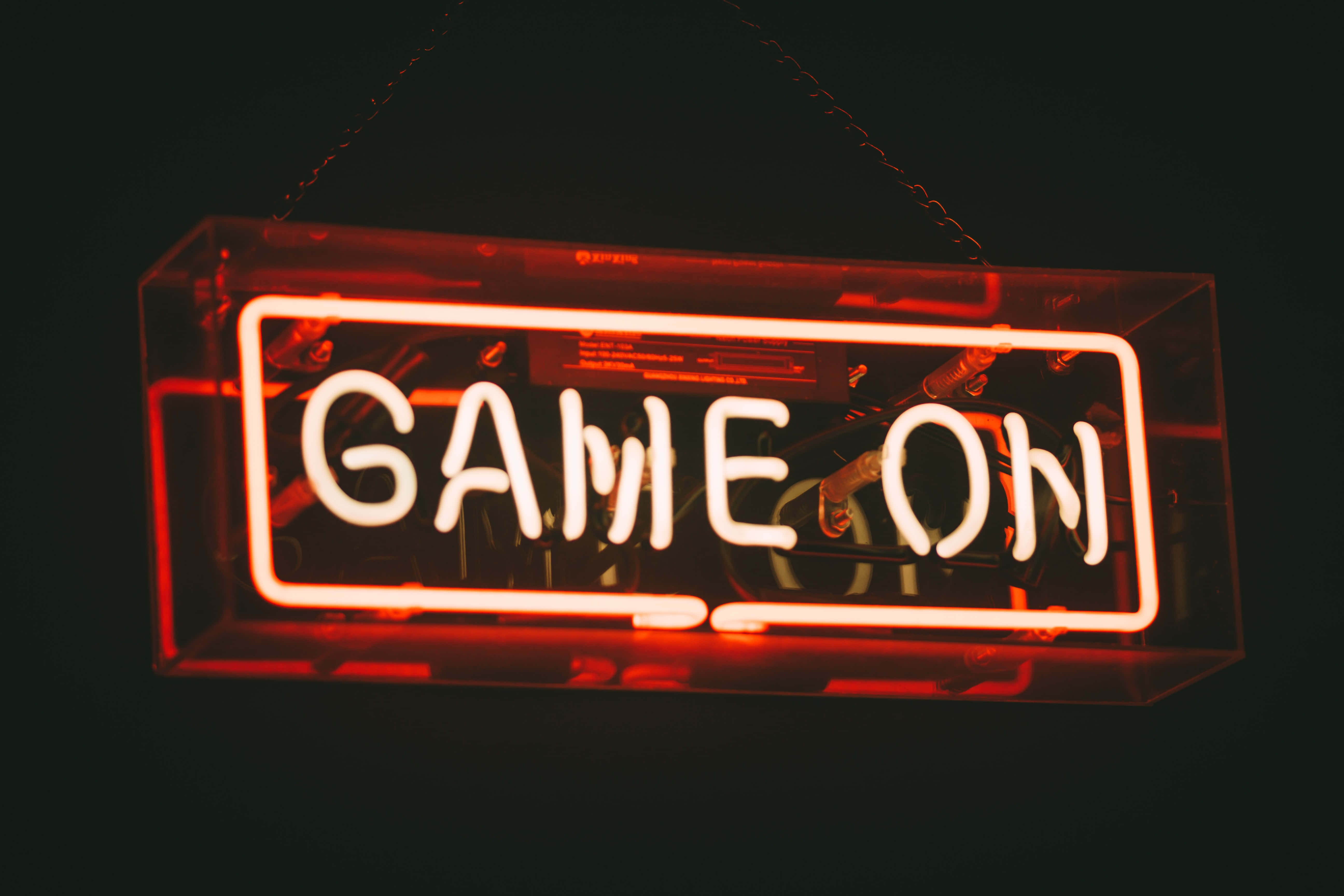 A Neon Sign That Says Game On Wallpaper