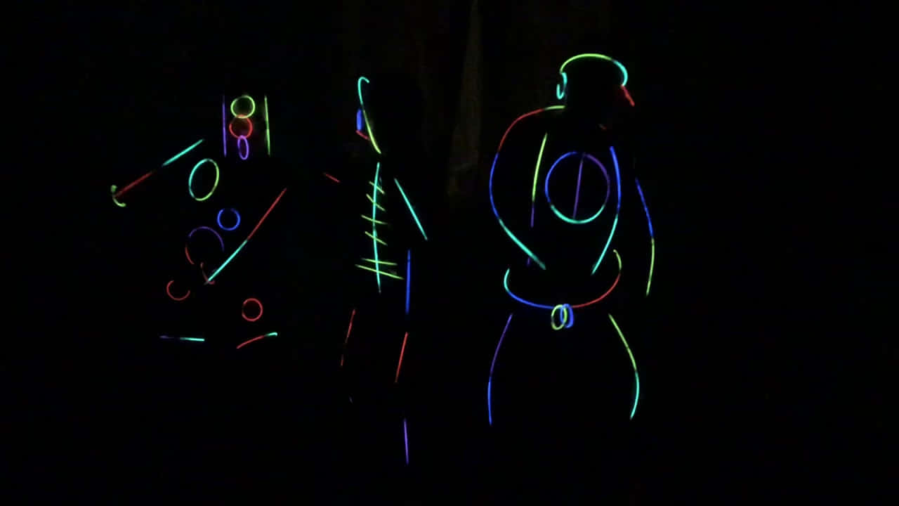 Neon Lit Dancers In Darkness Wallpaper