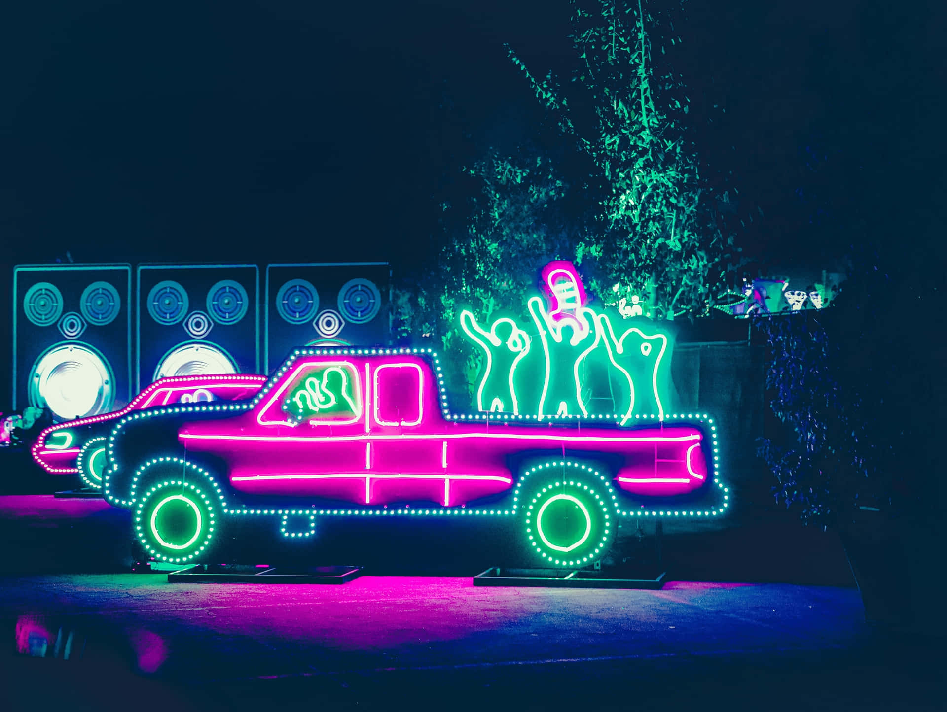 Neon Lit Truck With Dancing Figures Wallpaper