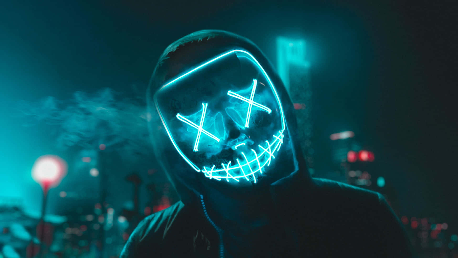 Caption: Radiant Neon Mask in the Dark Wallpaper