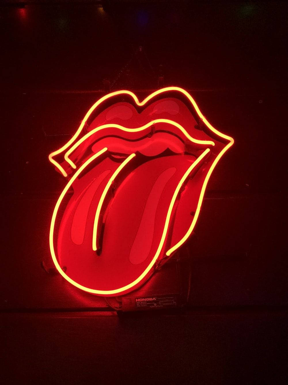 Neon Orange Aesthetic Rolling Stones Logo Wallpaper