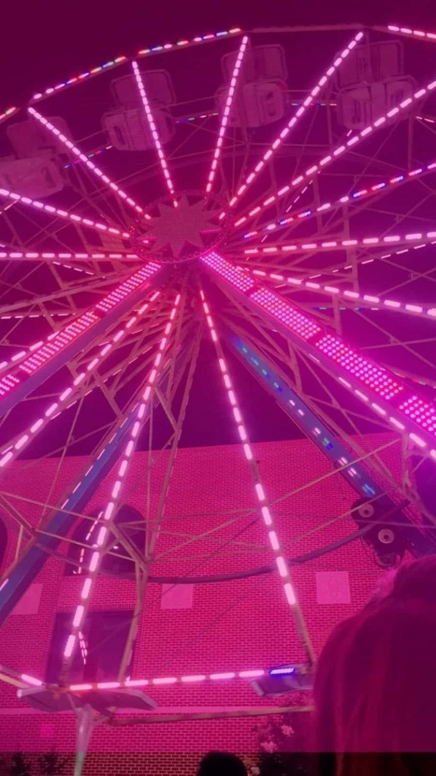 A Ferris Wheel With Lights On It