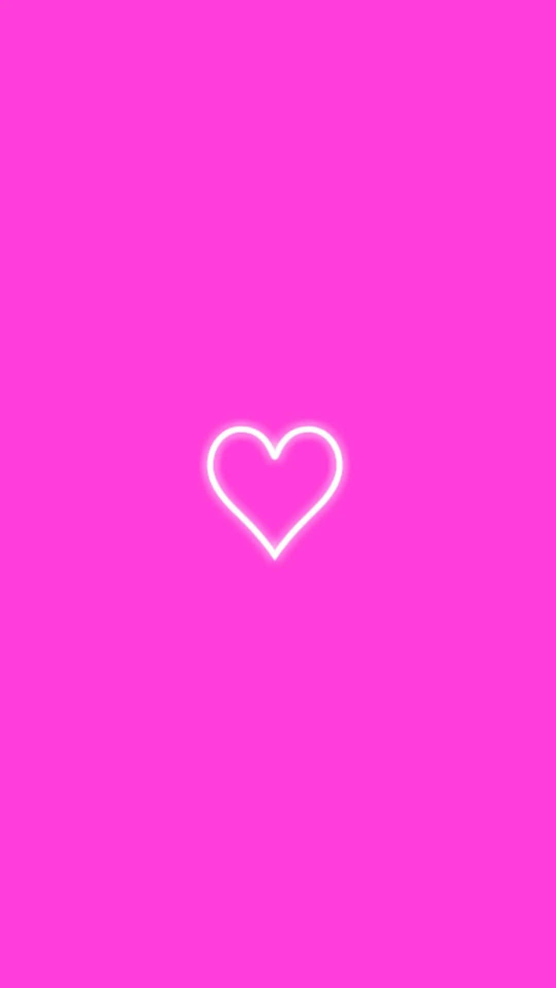 A Heart Shaped Neon Light On A Pink Background