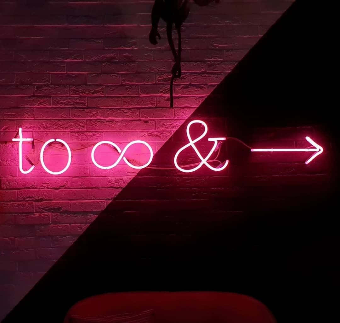 A Neon Sign With The Words To And T Wallpaper