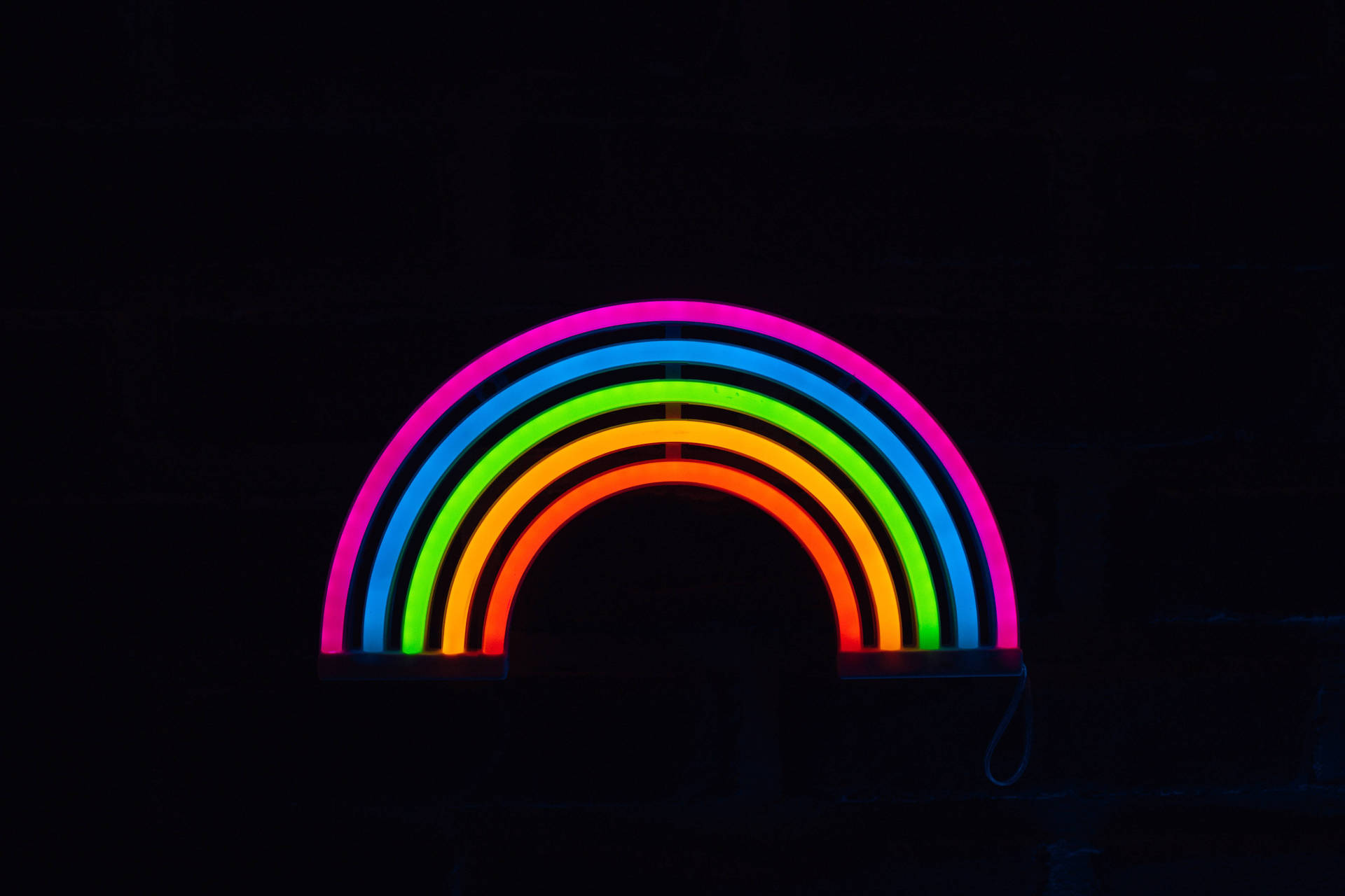 Neon Rainbow In Black Screen Wallpaper