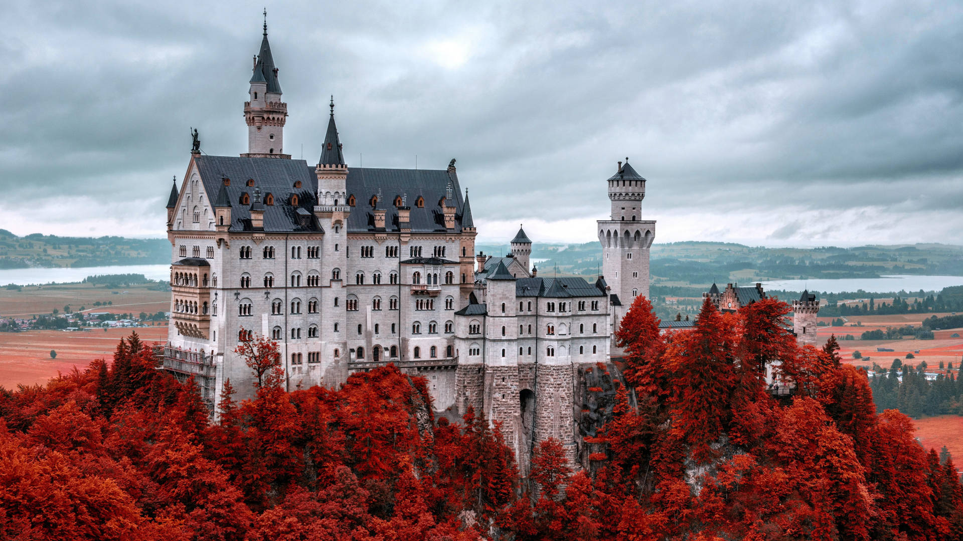 Mystical Neuschwanstein Castle amidst Autumnal Beauty Wallpaper