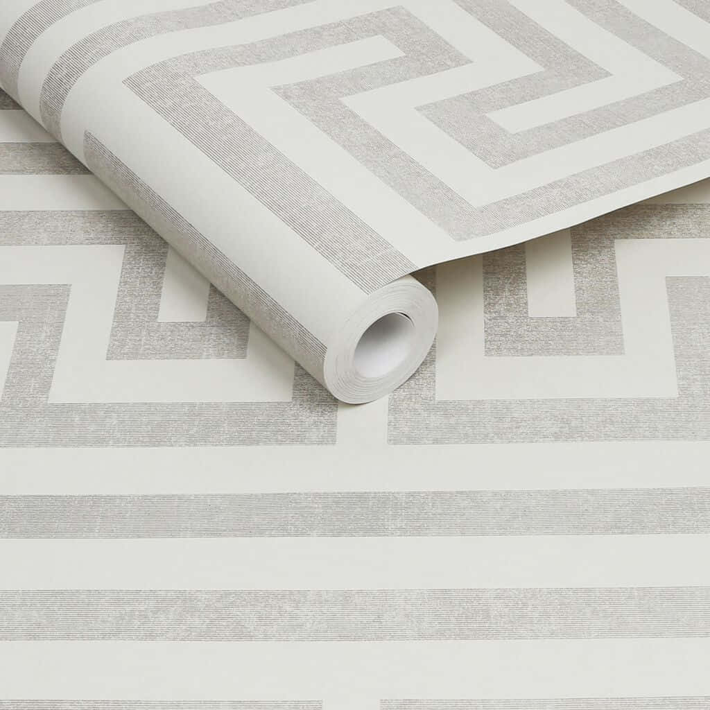A Roll Of Wallpaper With A White And Grey Pattern
