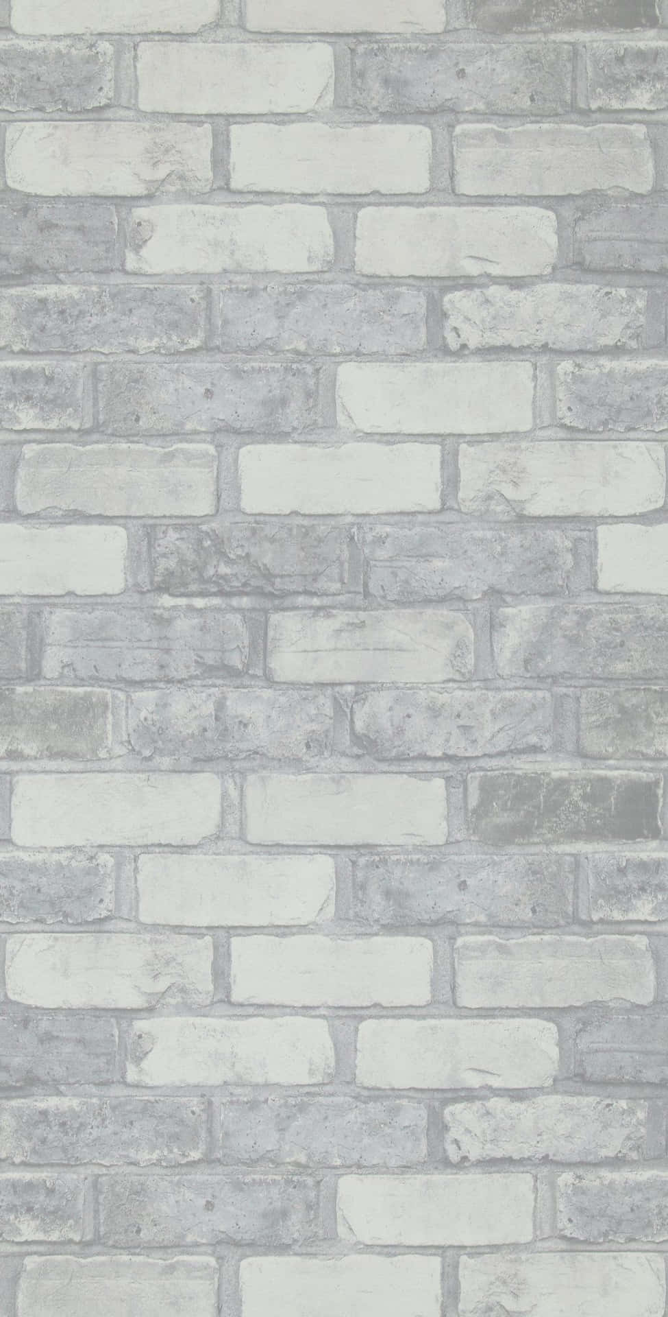 A White Brick Wall With Gray And White Bricks Wallpaper