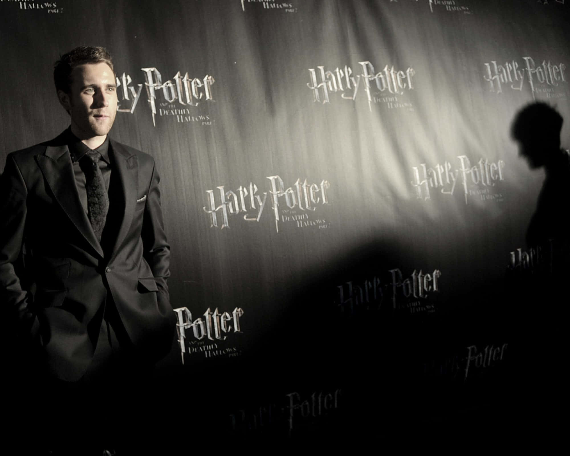 Neville Longbottom holding a wand in action Wallpaper