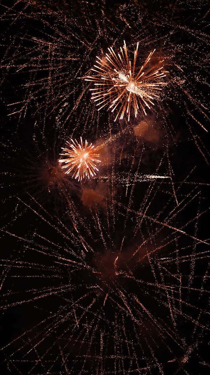 Fireworks In The Sky With A Black Background Wallpaper