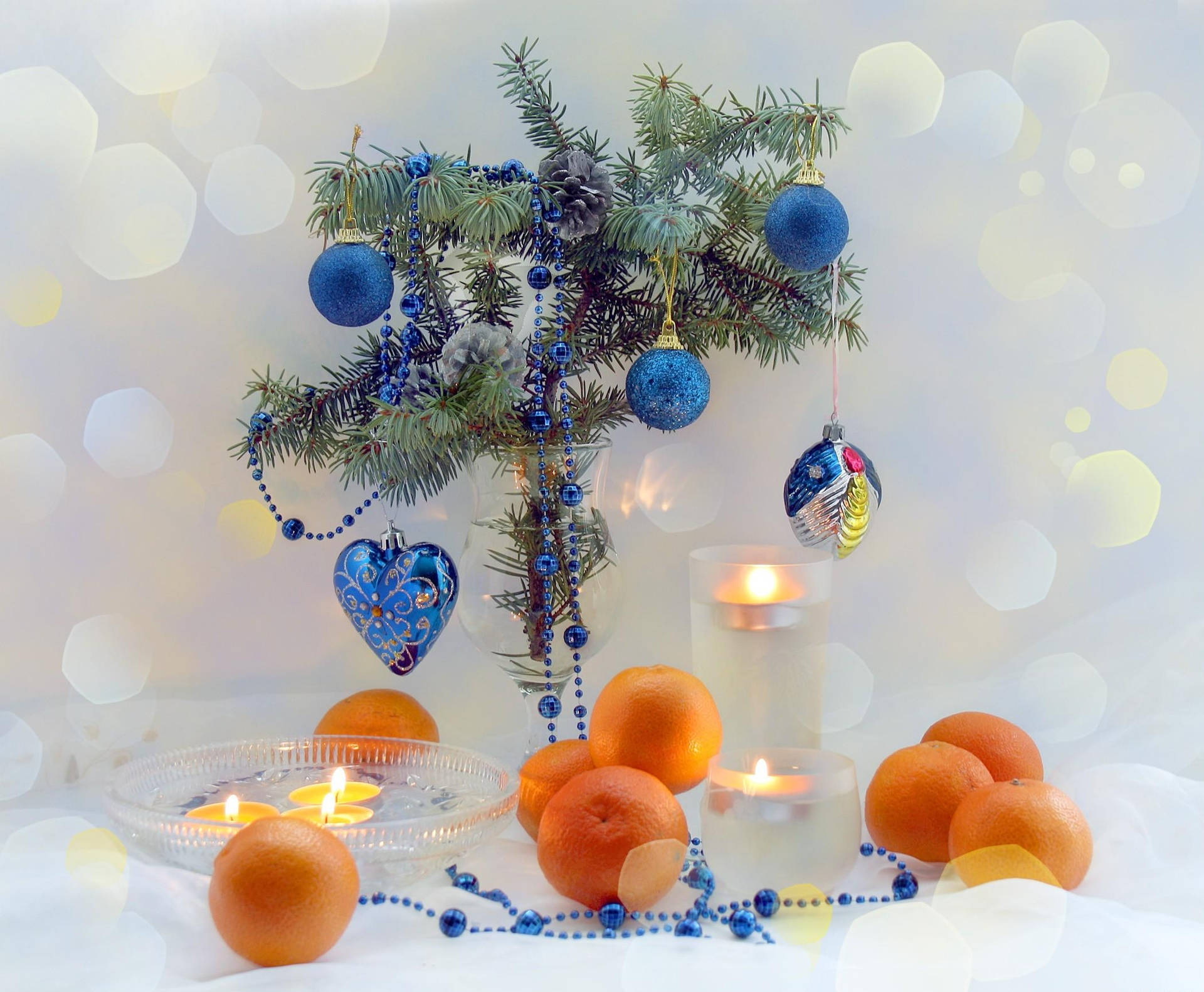 New Year's Decorations With Candles And Tangerines
