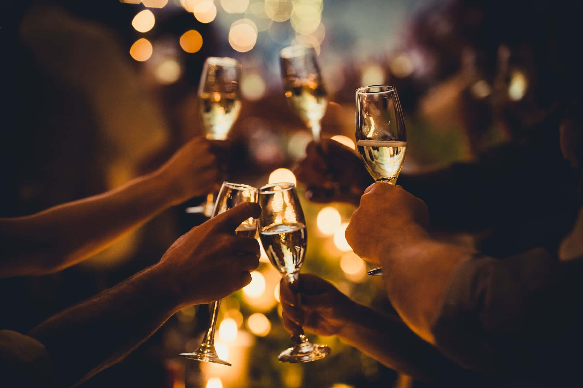 People Toasting Champagne Glasses At A Party
