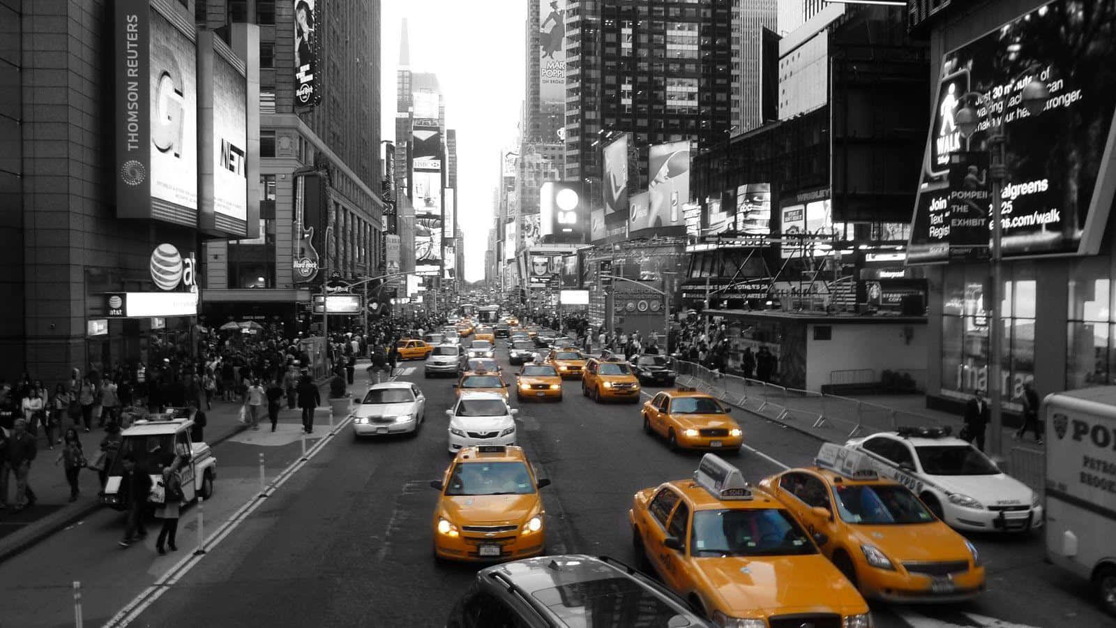 A Black And White Photo Of A City With Yellow Taxis