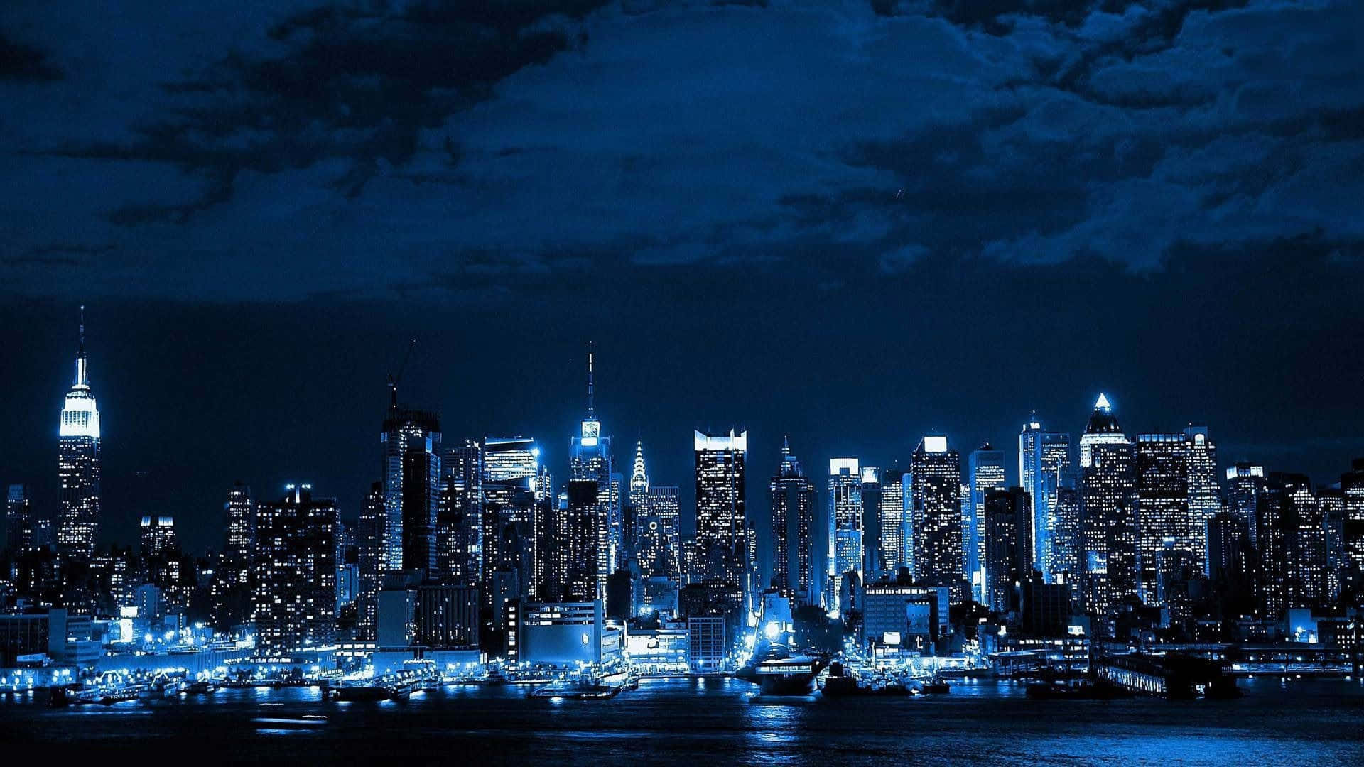Immagineluminosa Di New York City Di Notte Predominantemente Blu